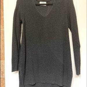 Womens size medium knit sweater. V neck. Slit down sides at bottom.